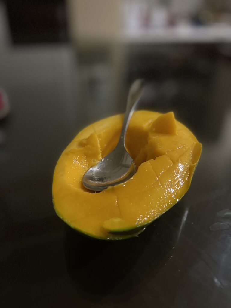 a fresh juicy mango, portrait mode, iphone 12 pro