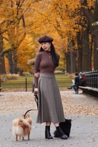 plaid skirt - Vivian R Tang poses in dark academia fashion in Central Park New York City NYC with her pomeranians against a fall setting